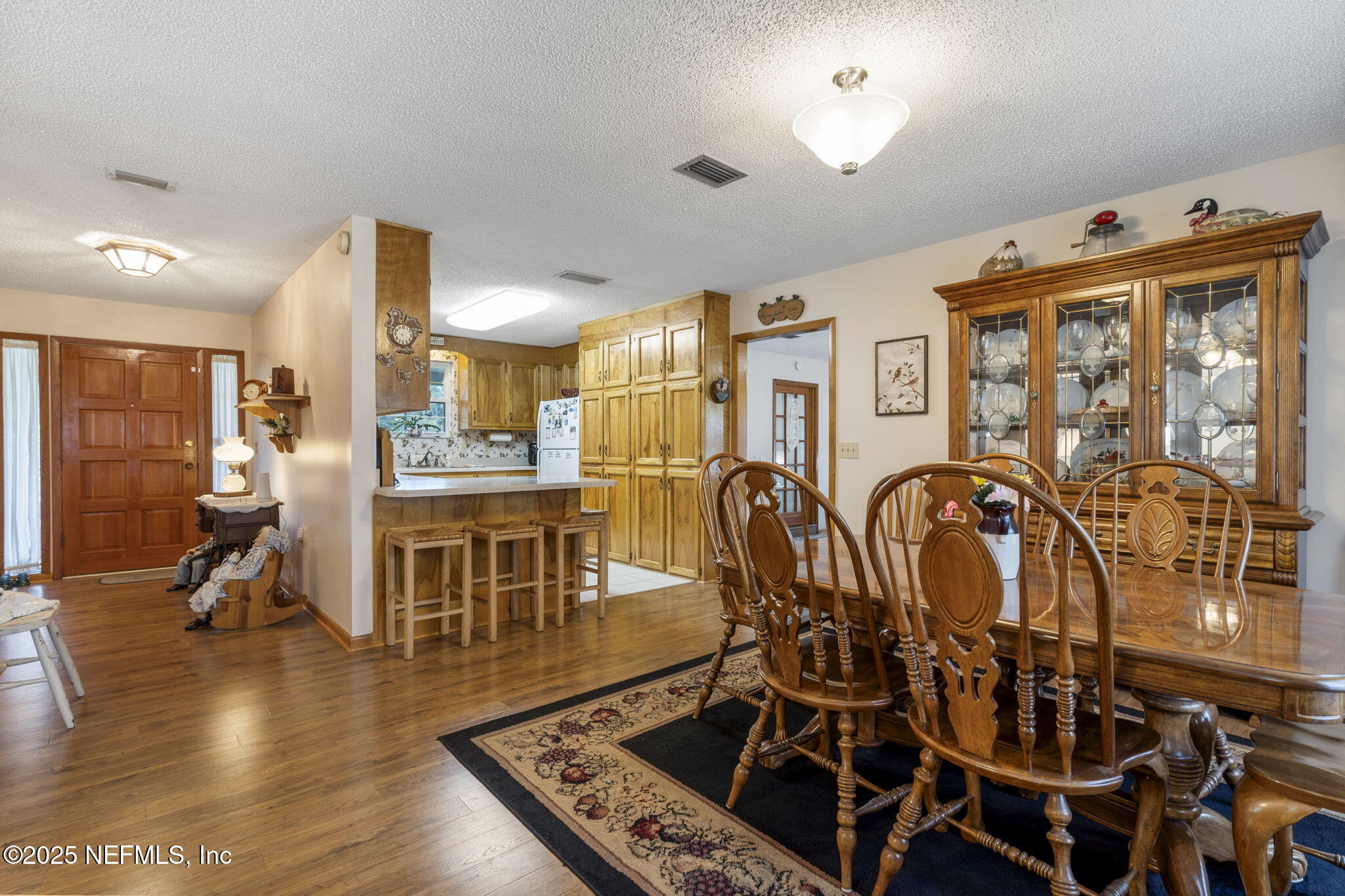 5893 George Hodges Road Macclenny, FL 32063 - Photo 21 of 56 a room with lots of chairs and mirrors