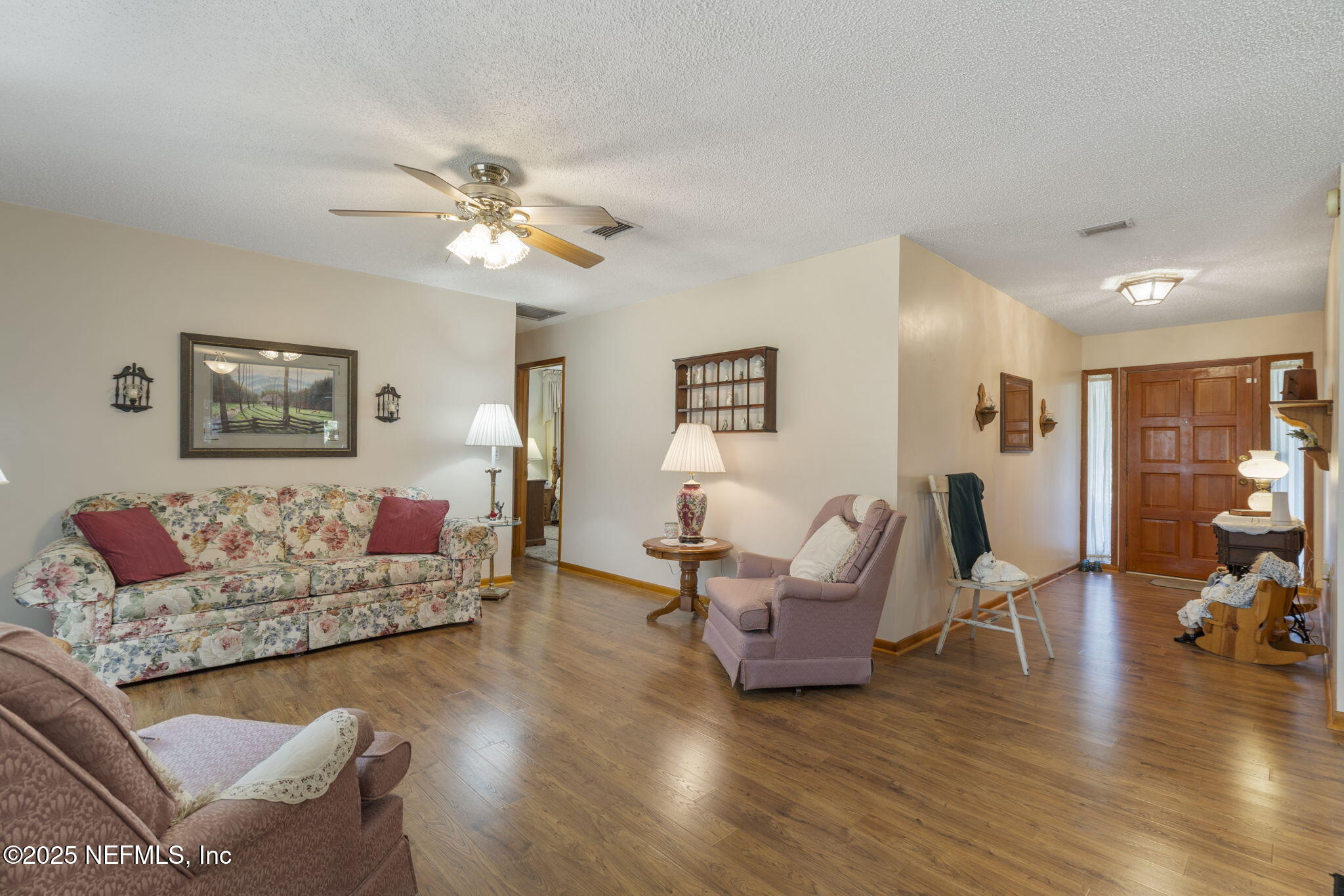 5893 George Hodges Road Macclenny, FL 32063 - Photo 22 of 56 a living room with furniture and wooden floor