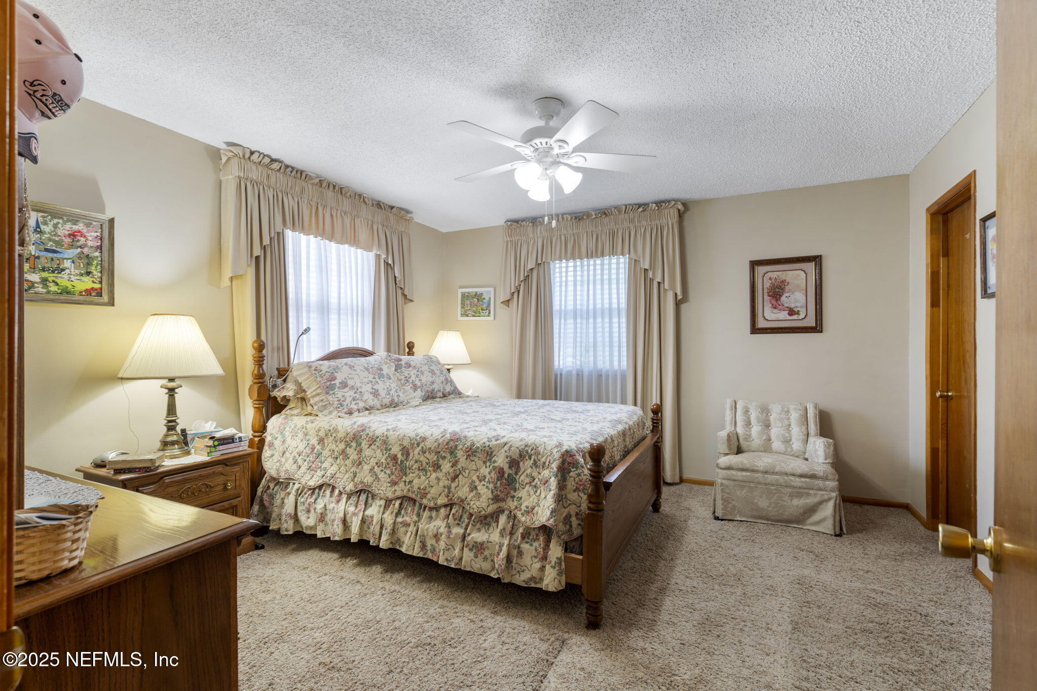 5893 George Hodges Road Macclenny, FL 32063 - Photo 23 of 56 a bedroom with a bed and a lamp
