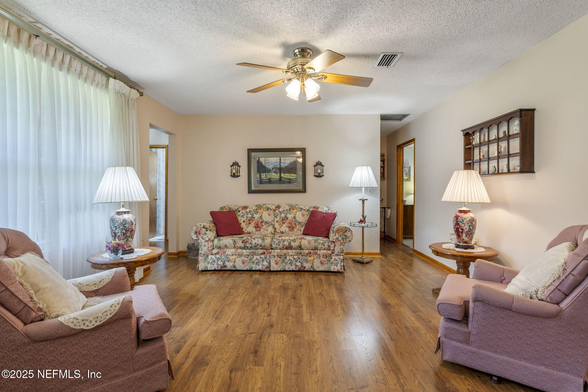 5893 George Hodges Road Macclenny, FL 32063 - Photo 31 of 56 a living room with furniture and wooden floor