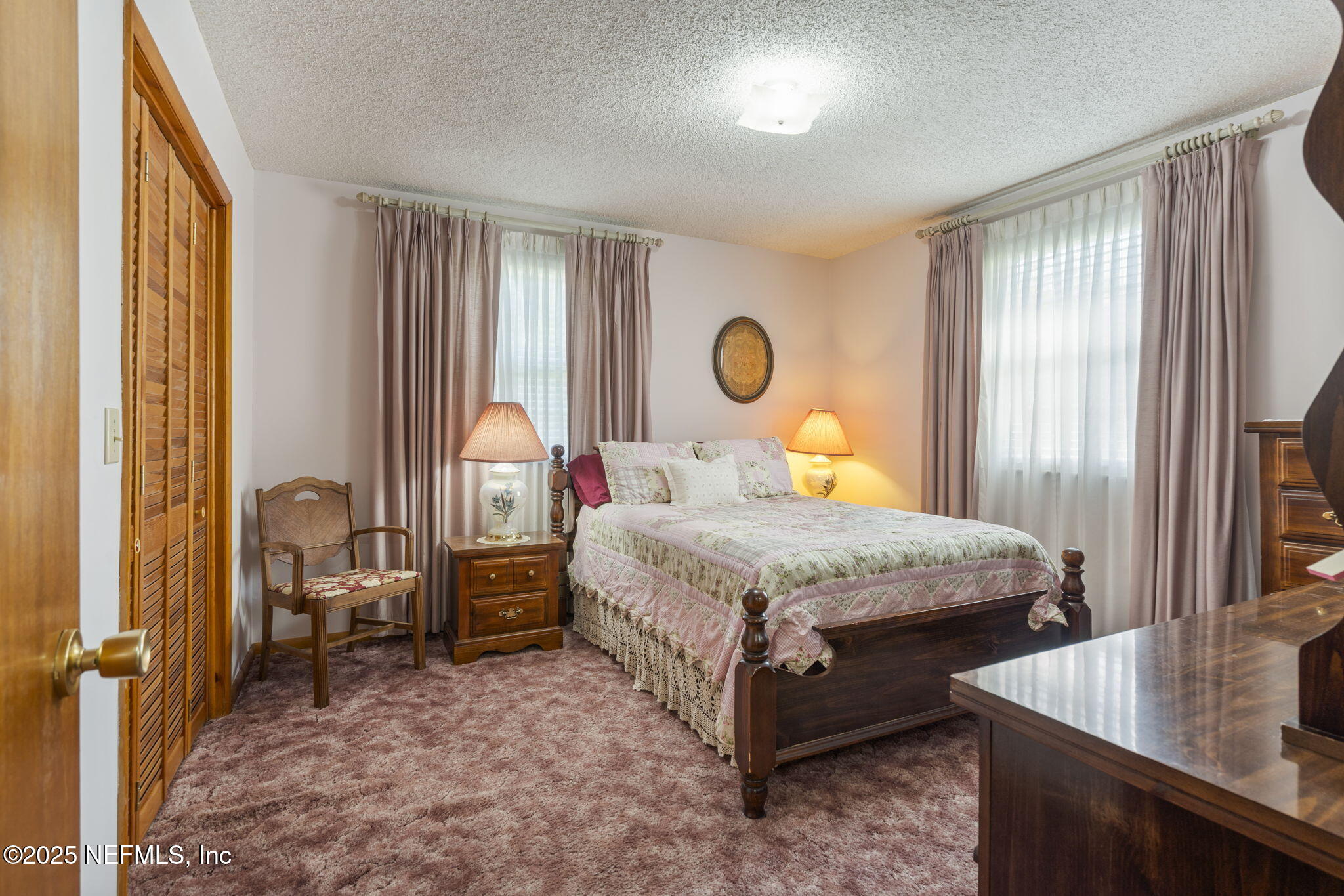 5893 George Hodges Road Macclenny, FL 32063 - Photo 32 of 56 a bedroom with a bed and a dresser next to a window