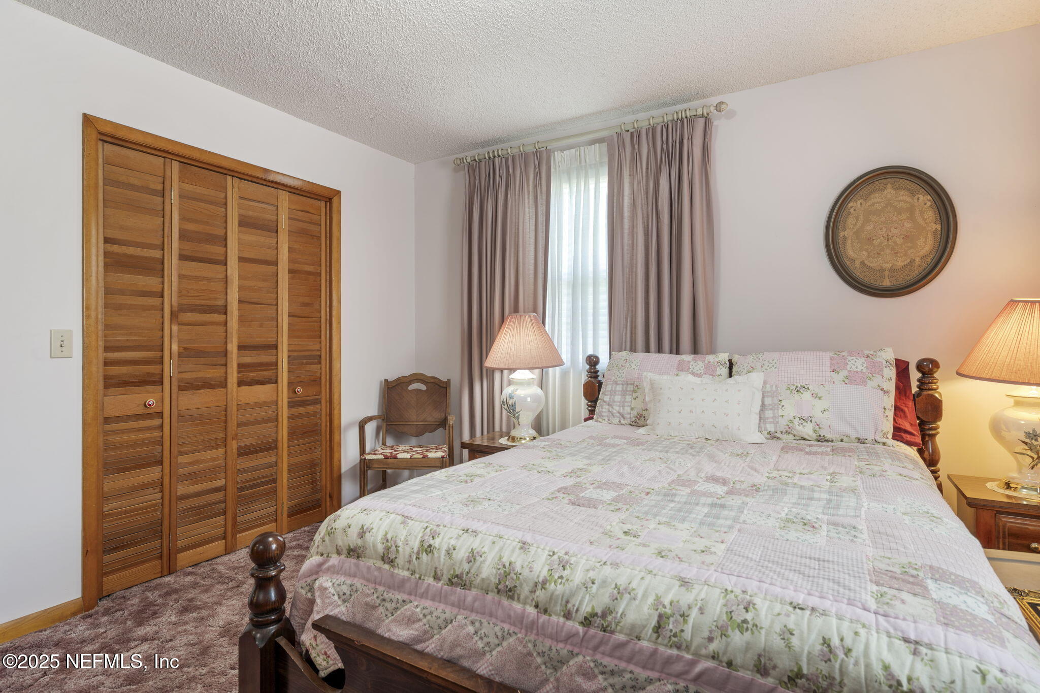 5893 George Hodges Road Macclenny, FL 32063 - Photo 33 of 56 a bedroom with a bed and a window