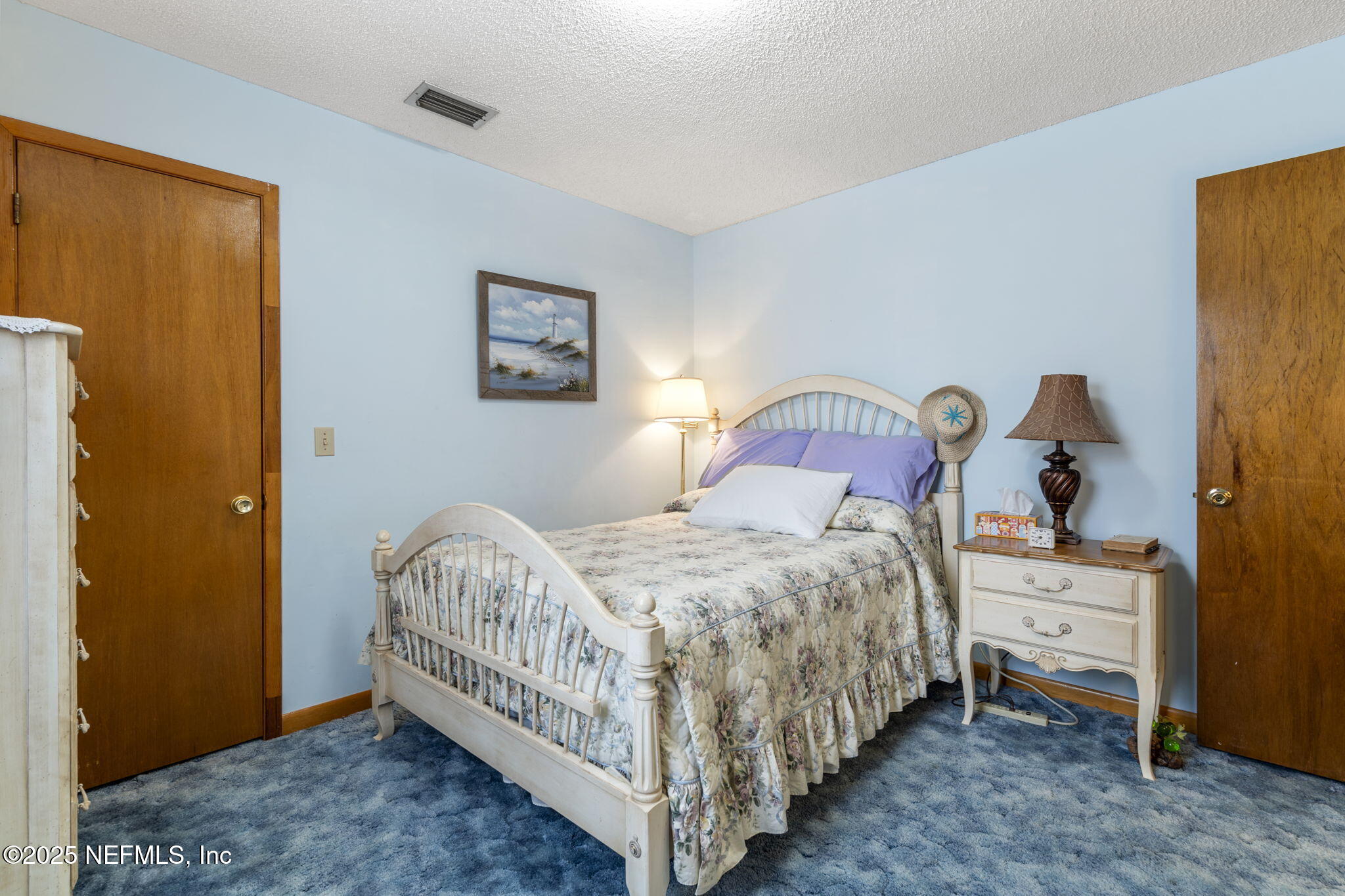 5893 George Hodges Road Macclenny, FL 32063 - Photo 36 of 56 a bedroom with a bed and a table in it