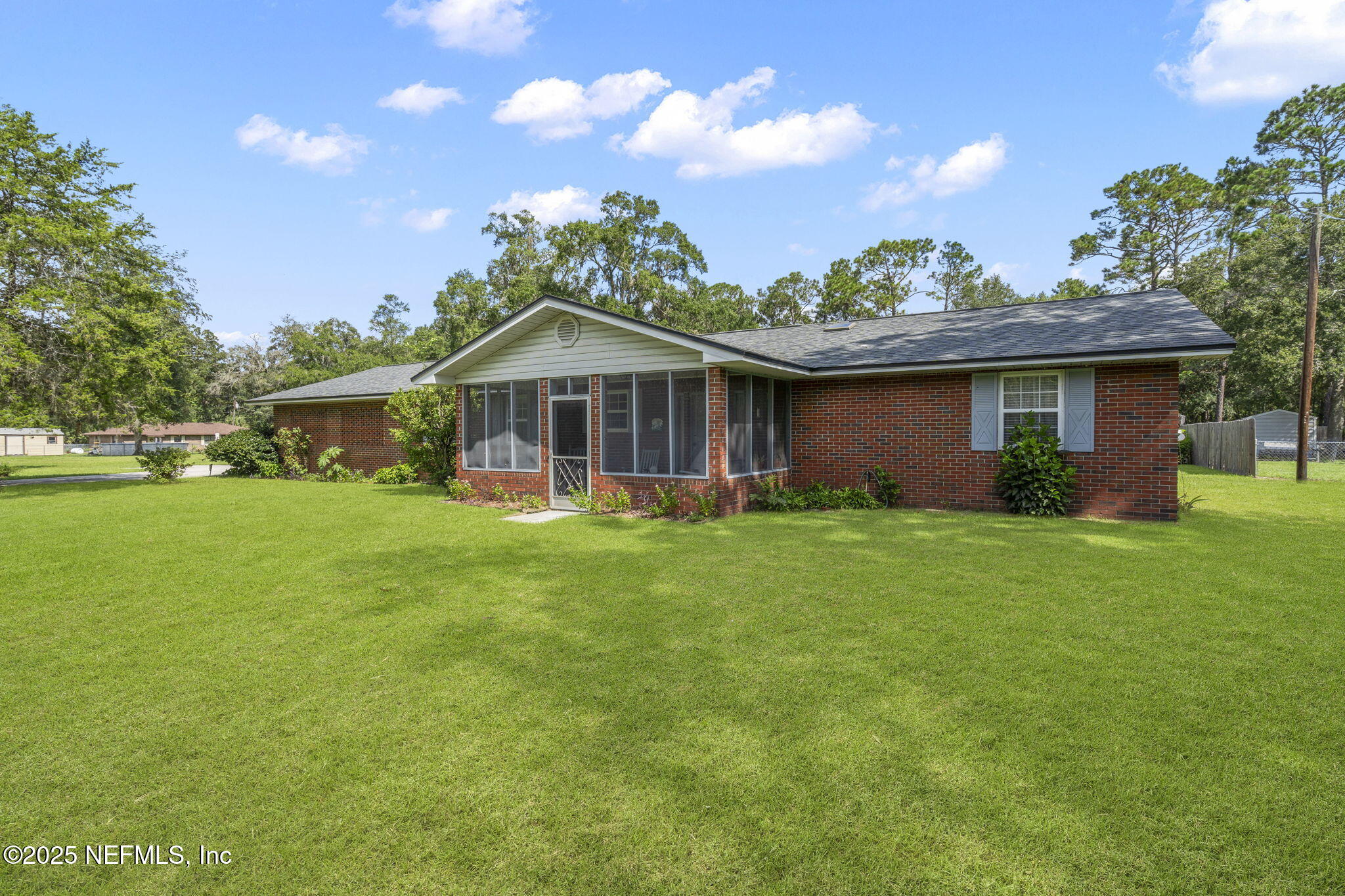 5893 George Hodges Road Macclenny, FL 32063 - Photo 37 of 56 a front view of a house with garden