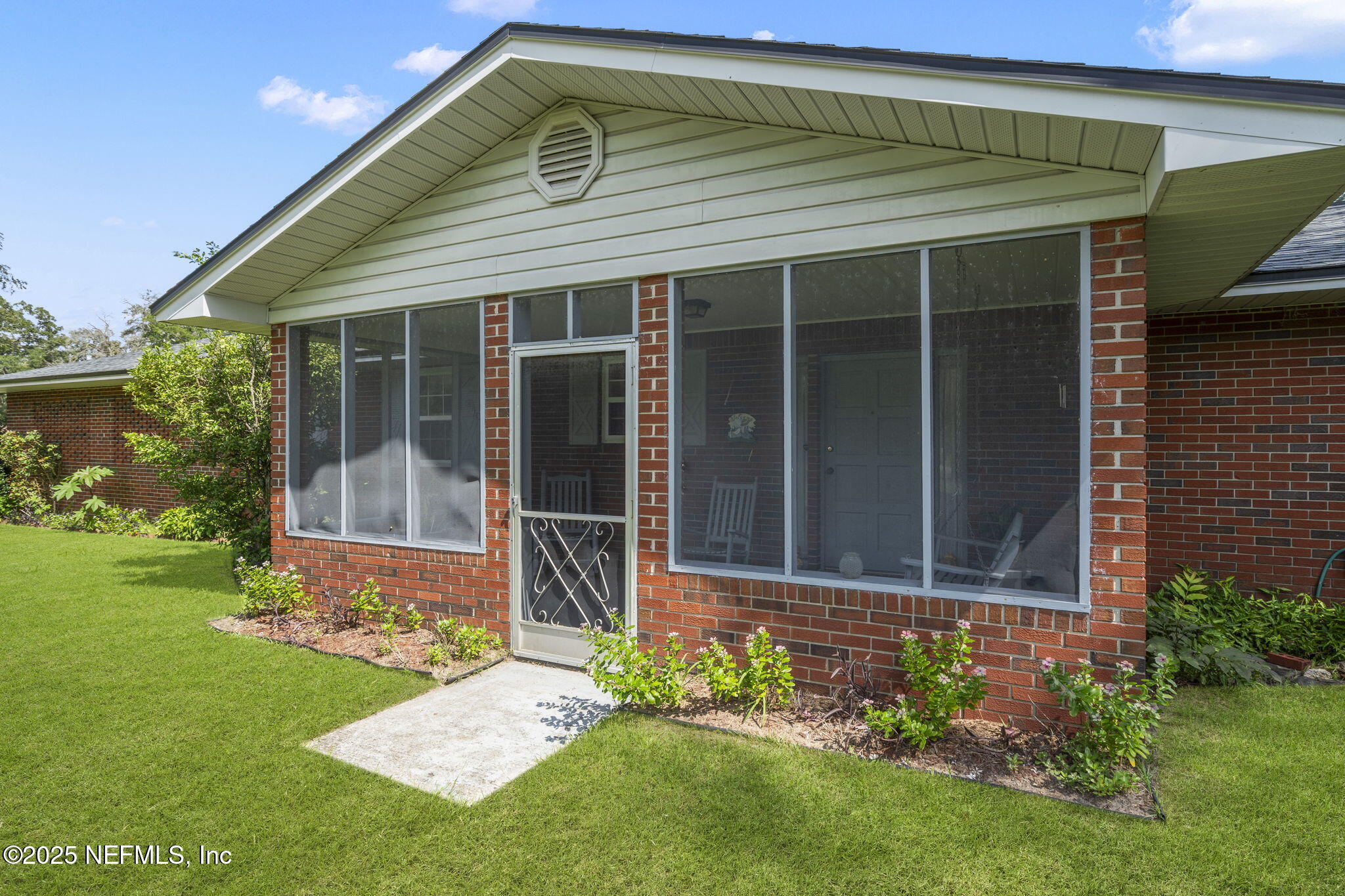 5893 George Hodges Road Macclenny, FL 32063 - Photo 38 of 56 a front view of a house with garden