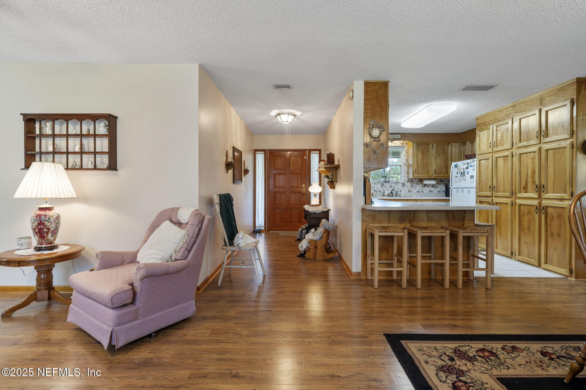 5893 George Hodges Road Macclenny, FL 32063 - Photo 41 of 56 a living room with furniture wooden floor and a table