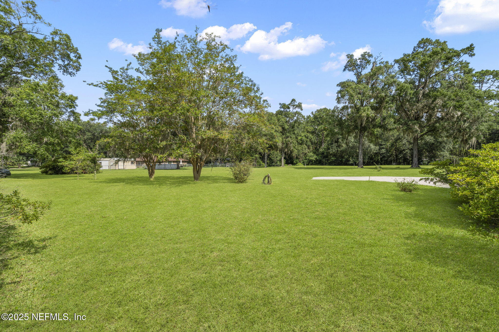 5893 George Hodges Road Macclenny, FL 32063 - Photo 44 of 56 a view of outdoor space with garden and trees