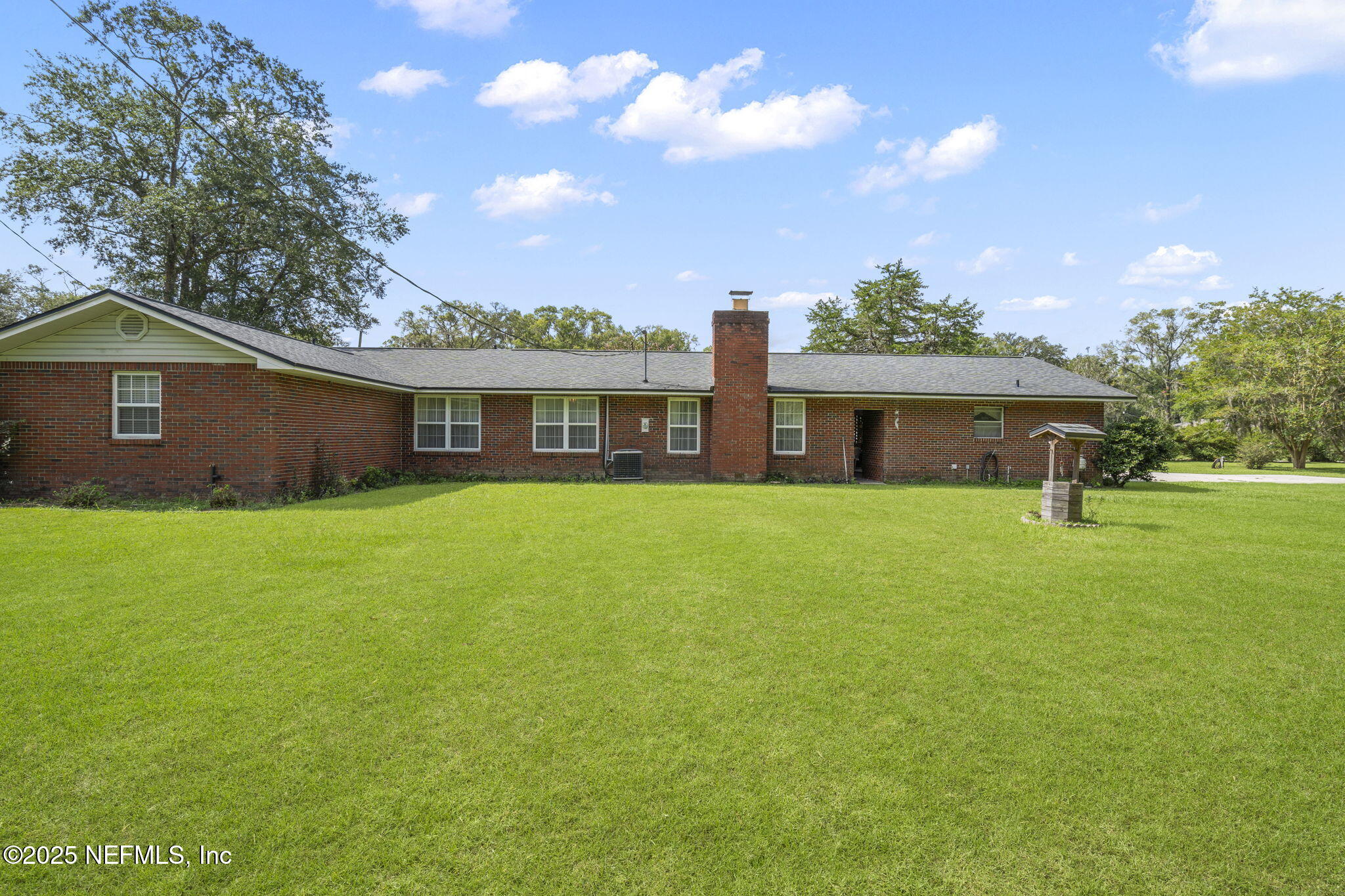 5893 George Hodges Road Macclenny, FL 32063 - Photo 46 of 56 a front view of a house with a garden