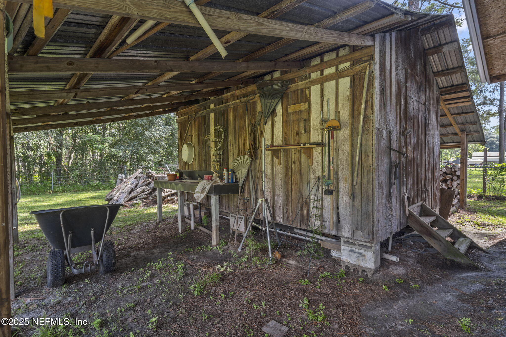 5893 George Hodges Road Macclenny, FL 32063 - Photo 53 of 56 a view of a porch with chairs and backyard