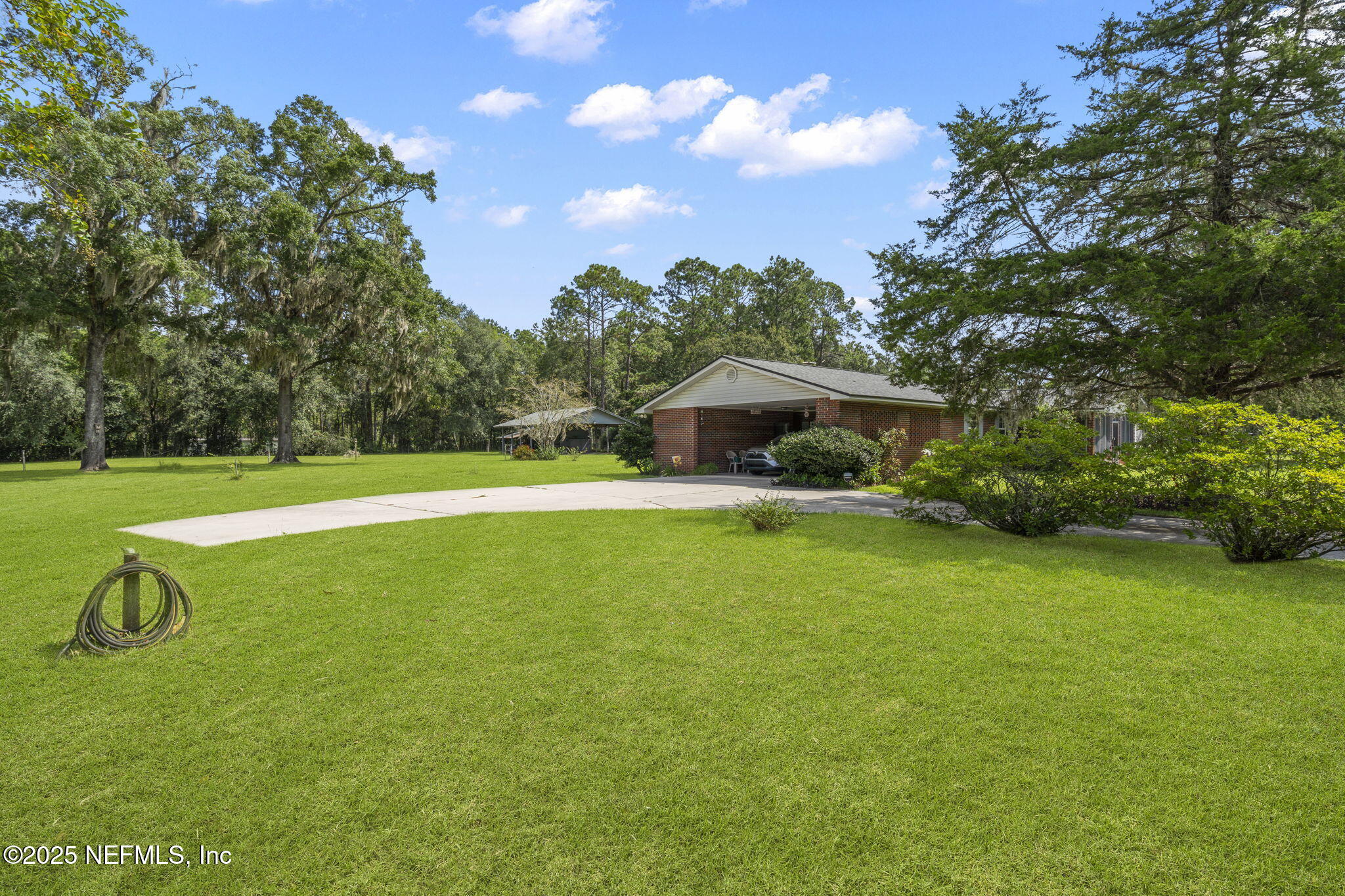 5893 George Hodges Road Macclenny, FL 32063 - Photo 6 of 56 a view of a house with a swimming pool