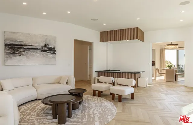 a living room with furniture and a lamp