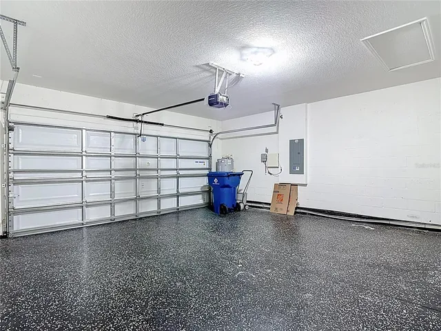 a bathroom with a granite countertop shower and a sink