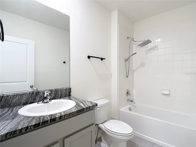 a view of swimming pool with outdoor seating and yard