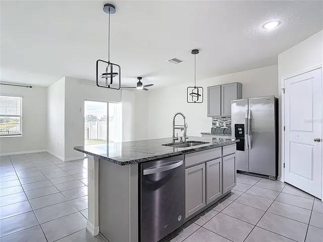 a kitchen with sink and window