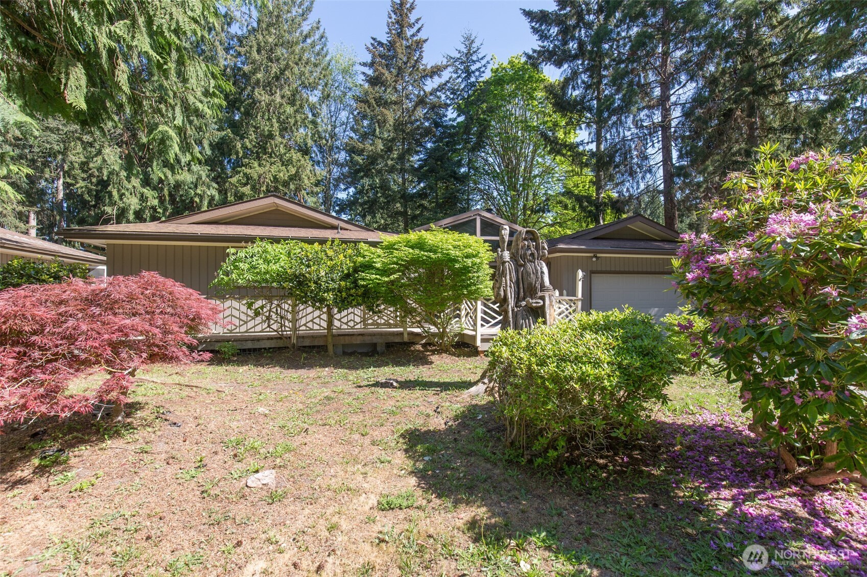 123 Forest Ridge Drive Sequim, WA 98382 - Photo 3 of 32 a backyard of a house with a yard and outdoor seating