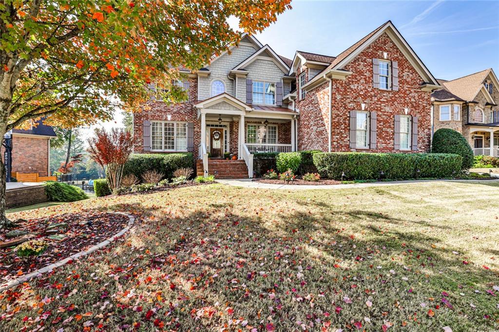 872 Pathview Court Dacula, GA 30019 - Photo 2 of 62 a front view of a house with a yard