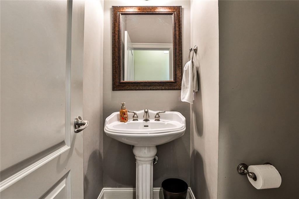 872 Pathview Court Dacula, GA 30019 - Photo 24 of 62 a bathroom with a sink and a mirror