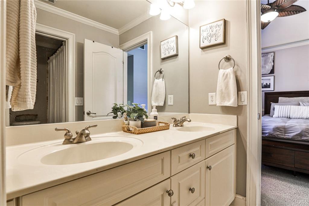 872 Pathview Court Dacula, GA 30019 - Photo 27 of 62 a bathroom with a sink and a mirror