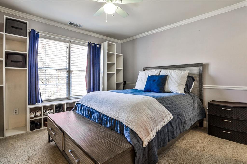 872 Pathview Court Dacula, GA 30019 - Photo 28 of 62 a bedroom with a bed and a dresser