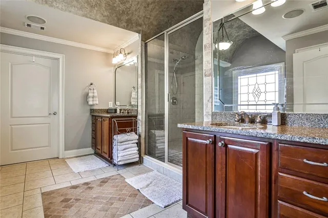 a bedroom with furniture a flat screen tv and a fireplace