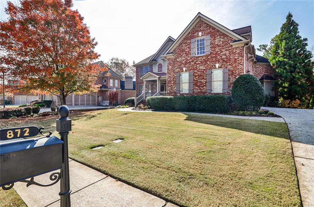 872 Pathview Court Dacula, GA 30019 - Photo 4 of 62 a front view of a house with yard