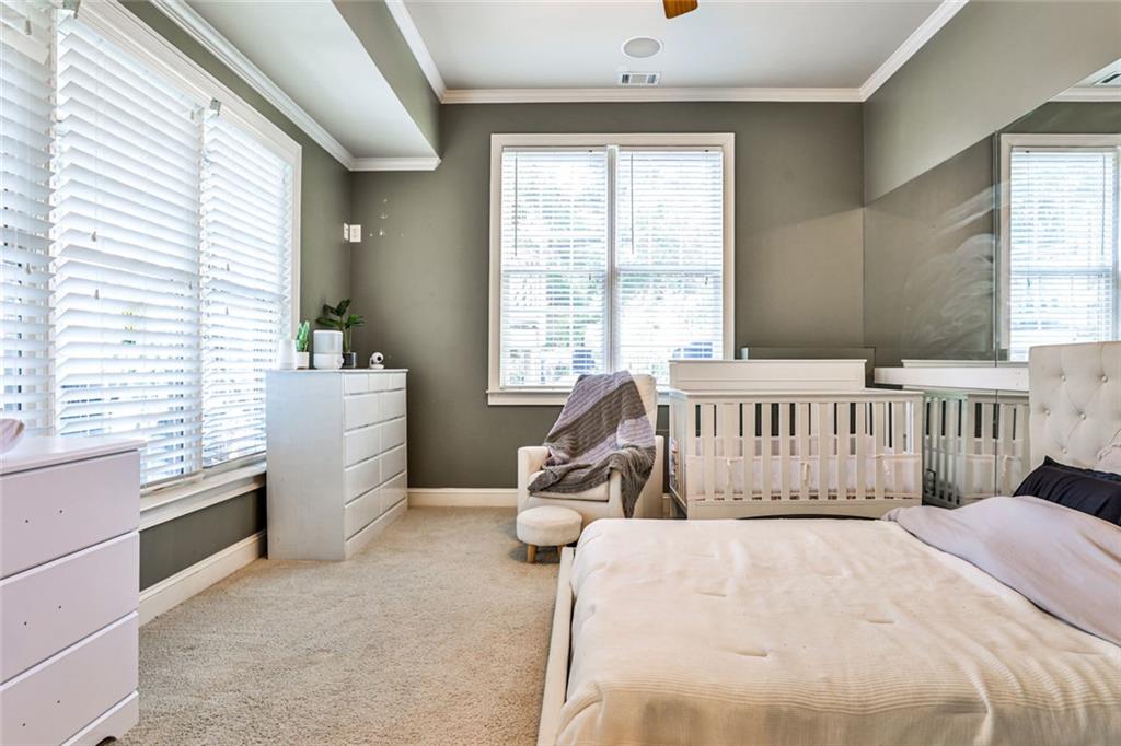 872 Pathview Court Dacula, GA 30019 - Photo 44 of 62 a bedroom with a bed and a window