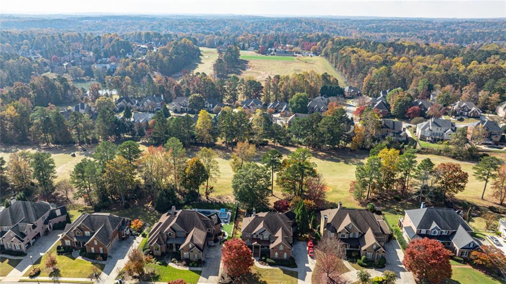 872 Pathview Court Dacula, GA 30019 - Photo 55 of 62 an aerial view of lake and residential houses with outdoor space