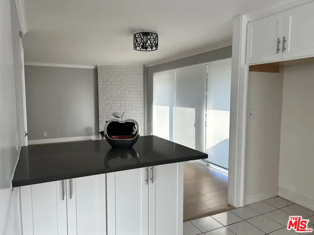 a kitchen with a sink and a refrigerator