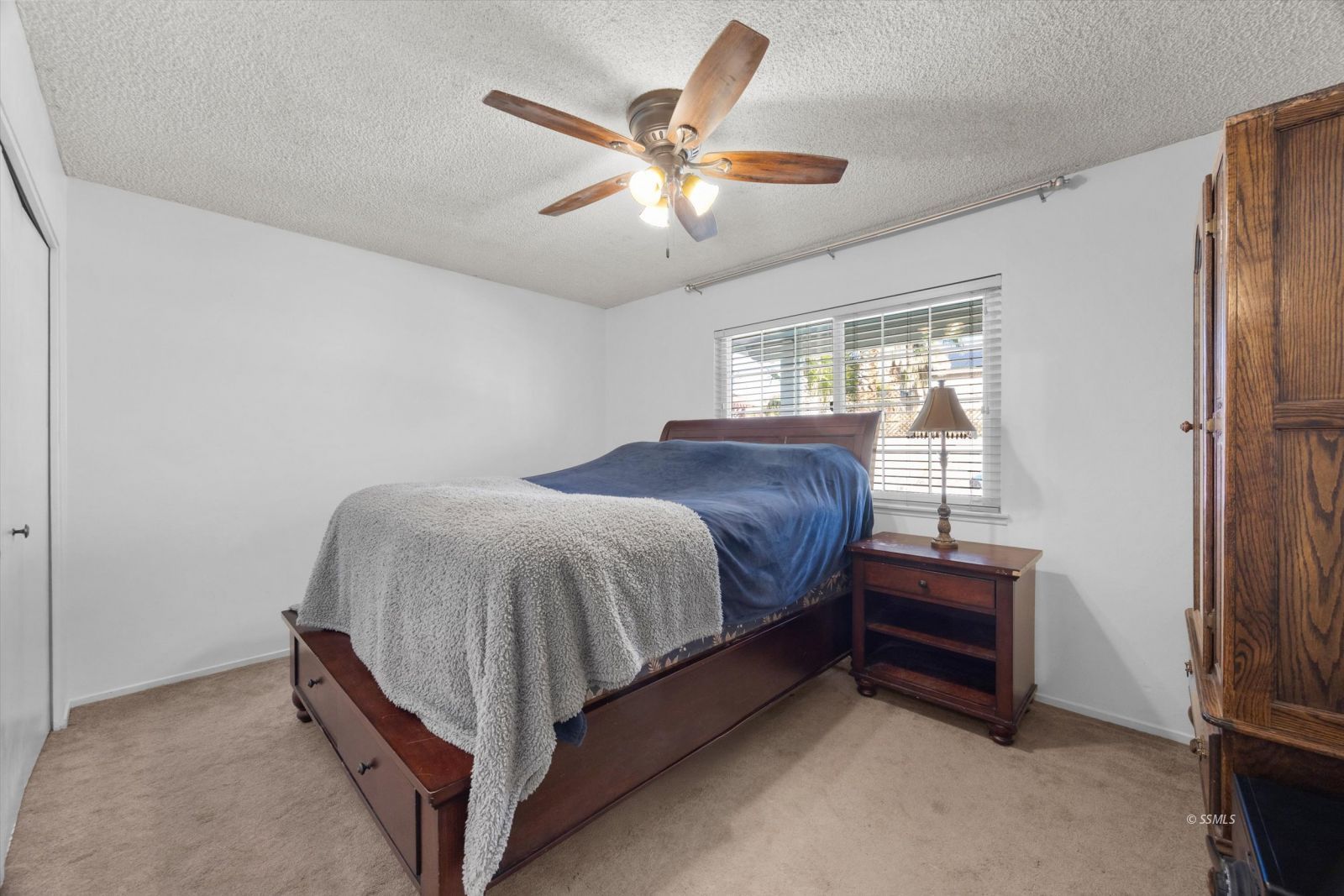 736 Fendrick Circle Ridgecrest, CA 93555 - Photo 33 of 49 a bed room with a bed and a ceiling fan
