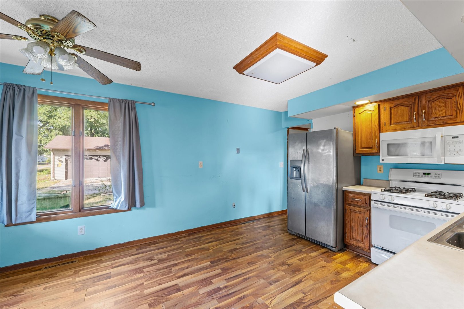106 East Union Street Mahomet, IL 61853 - Photo 11 of 24 a kitchen with stainless steel appliances granite countertop a refrigerator and a sink