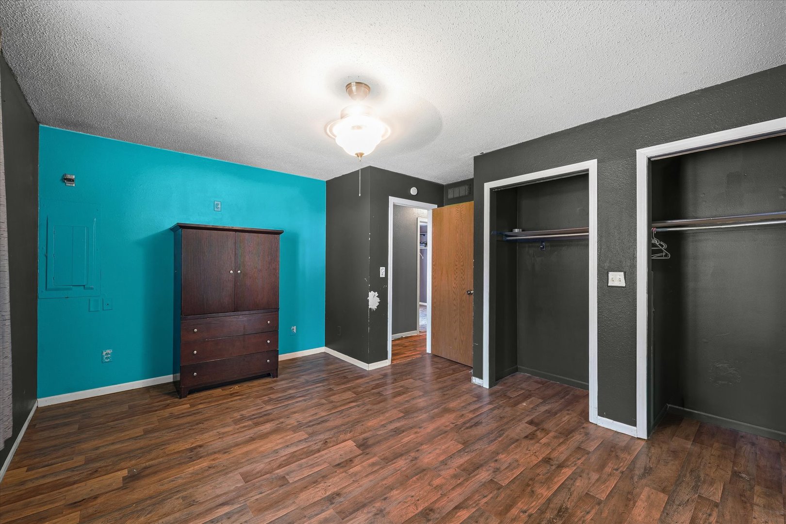 106 East Union Street Mahomet, IL 61853 - Photo 15 of 24 an empty room with closet and wooden floor