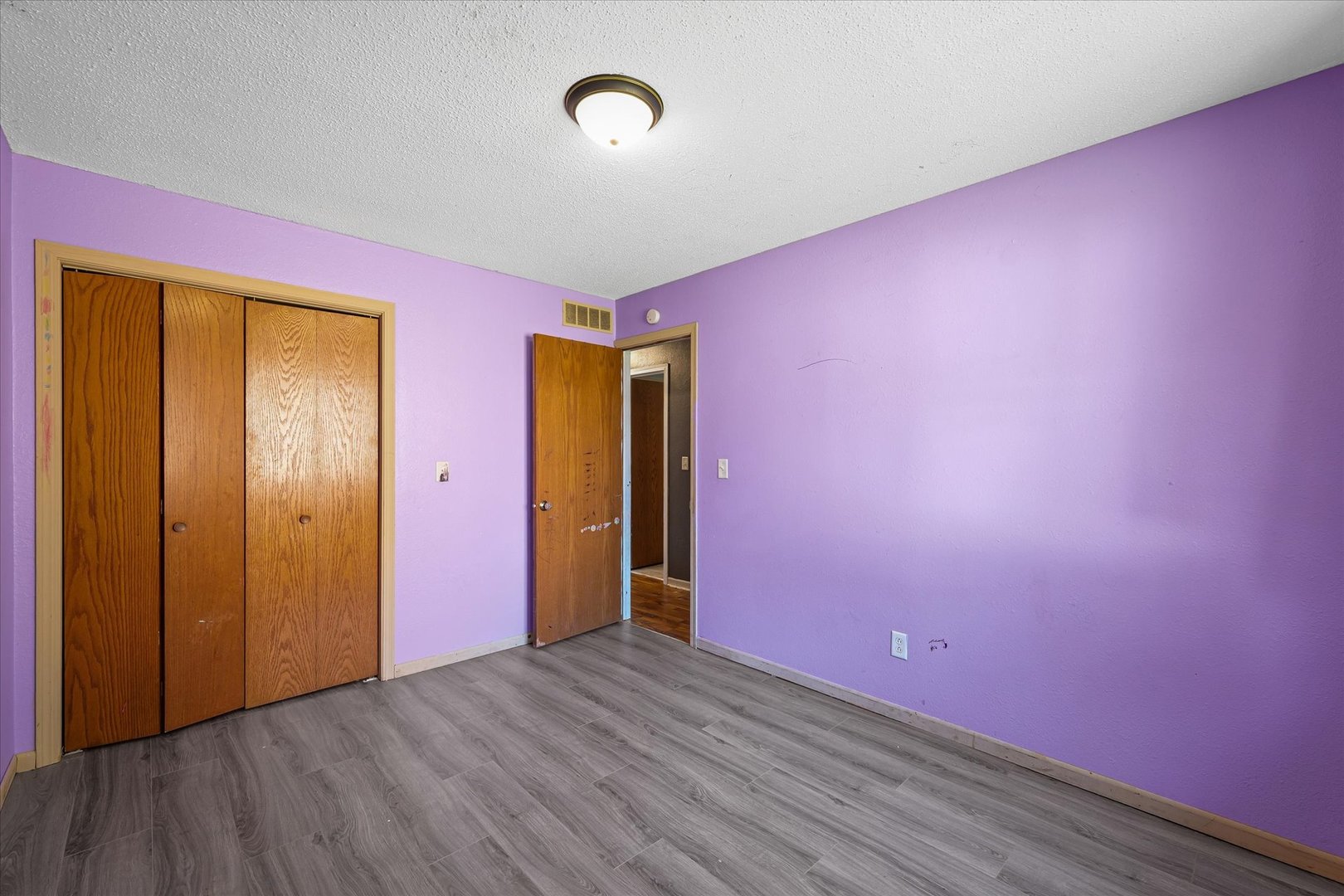 106 East Union Street Mahomet, IL 61853 - Photo 18 of 24 an empty room with wooden floor and windows