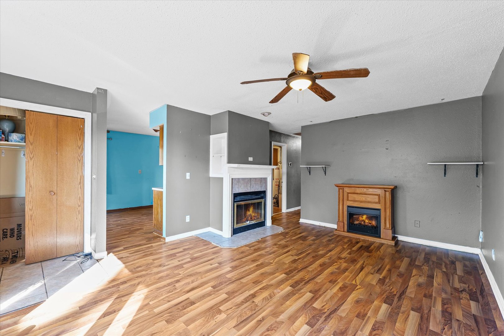 106 East Union Street Mahomet, IL 61853 - Photo 8 of 24 a view of a livingroom with a fireplace and cabinet