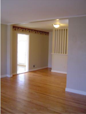 3067 Sedgefield Road Southwest Roanoke, VA 24018 - Photo 3 of 8 a view of an empty room with wooden floor and a window
