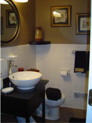 3067 Sedgefield Road Southwest Roanoke, VA 24018 - Photo 5 of 8 a bathroom with a toilet a sink and a mirror
