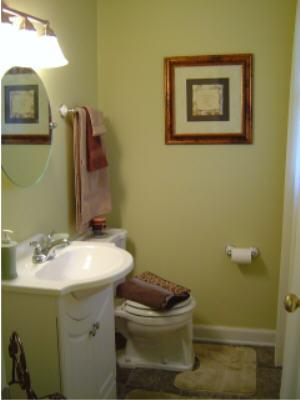 3067 Sedgefield Road Southwest Roanoke, VA 24018 - Photo 6 of 8 a bathroom with a sink toilet and mirror