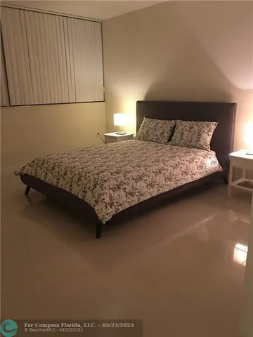 a bedroom with a bed and dresser