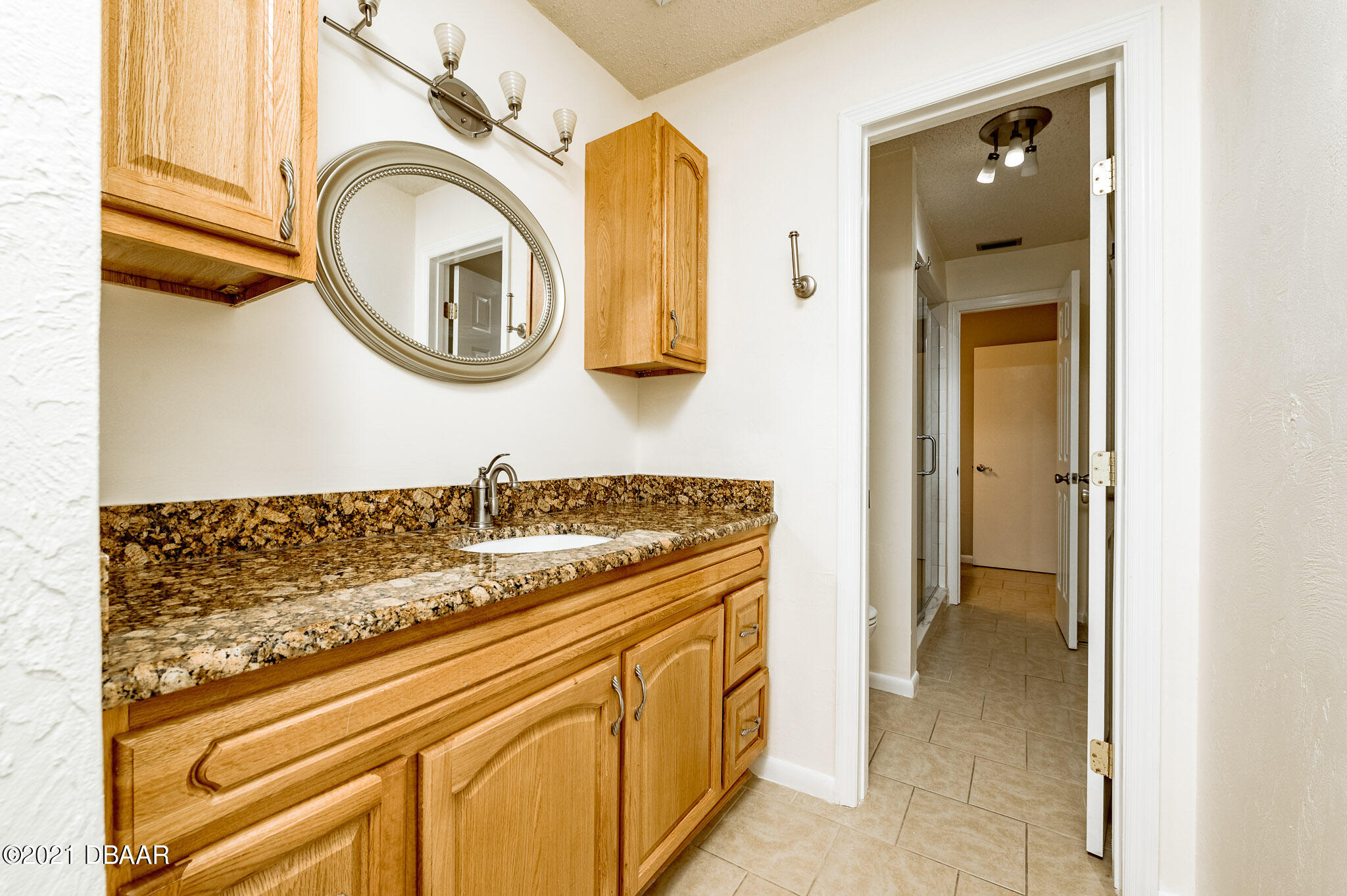 11 Birchwood Trail Ormond Beach, FL 32174 - Photo 16 of 24 a bathroom with a sink and a mirror