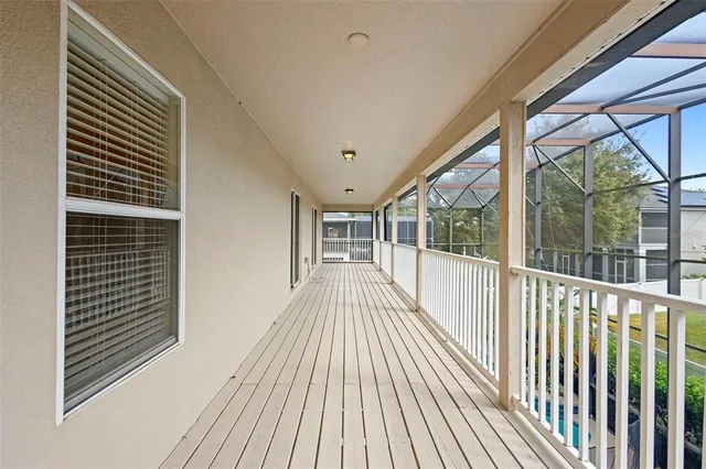 a view of a balcony with wooden floor