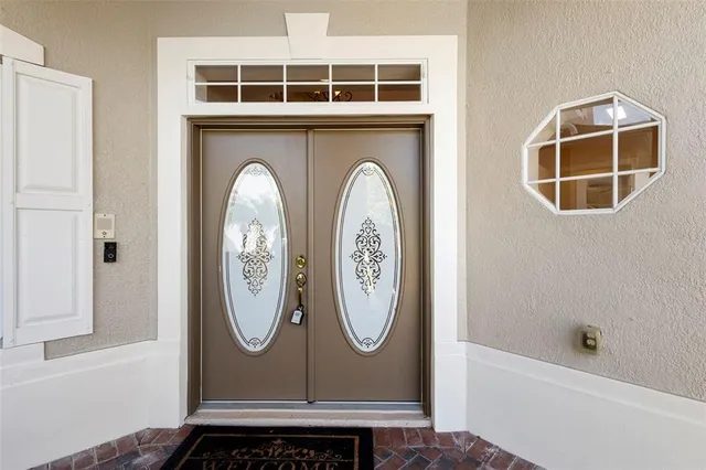 a front view of a house with a yard and porch