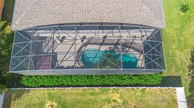a view of a patio with table and chairs with wooden floor and fence