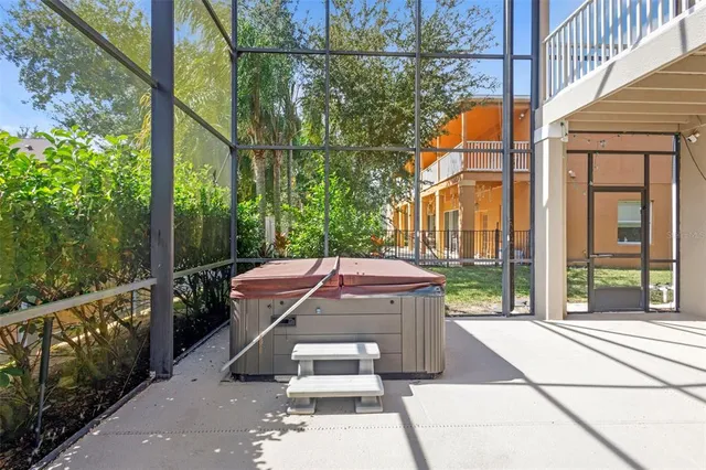 an aerial view of a house with a yard and lake view