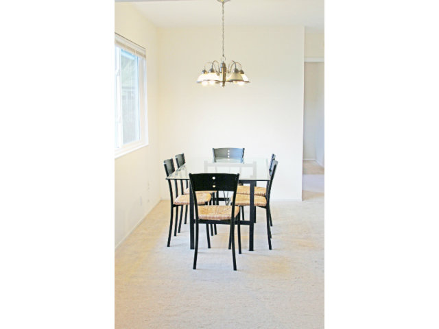 337 Monterey Road Pacifica, CA 94044 - Photo 8 of 21 a dining room with a table and chairs