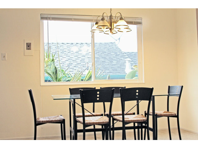 337 Monterey Road Pacifica, CA 94044 - Photo 9 of 21 a view of a dining room with furniture and a window