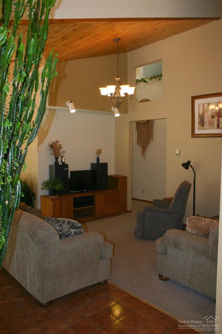 63488 Abbey Road Bend, OR 97701 - Photo 10 of 25 a living room with furniture and a chandelier