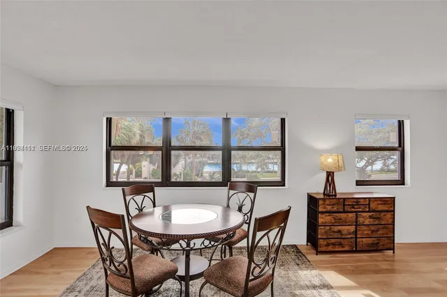 a bathroom with a sink a mirror and a shower