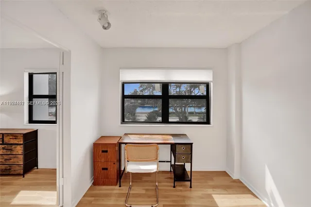 a view of a livingroom with furniture and windows