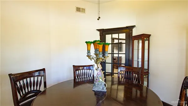 a view of a hallway with a chandelier