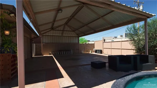a view of a swimming pool with lawn chairs