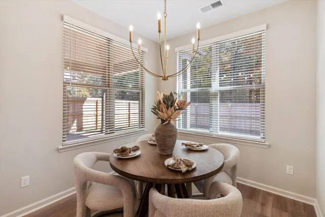 a dining room with furniture and windows